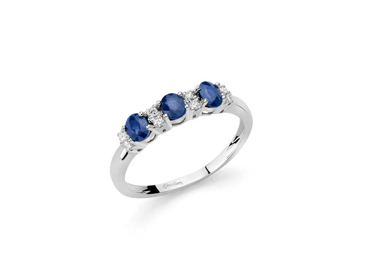 Anello trilogy con diamanti e zaffiri blu